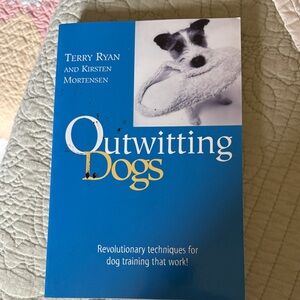Outwitting Dogs by Terry Ryan and Kirsten Mortensen - Blue Cover